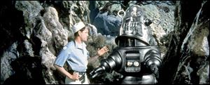 Robbie the Robot, shown in Forbidden Planet, is an endearing symbol of science fiction.