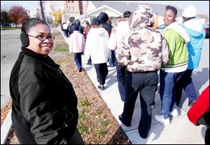 Lucas County Sheriff's Deputy Sonja Jackson, right, escorts seventh and eighth-grade girls to the Toledo Art Museum.