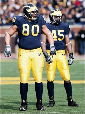 Alan Branch, left, 336-pound tackle, and David Harris, inside linebacker, are two reasons why Michigan's defense has only allowed an average of 30.3 rushing yards and 3 rushing TDs in 10 games.