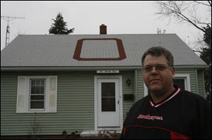Jeff Lantz's home along the Anthony Wayne Trail gets lots of attention with his rooftop display of devotion to Ohio State.