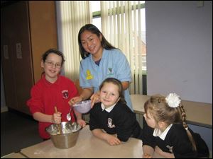 Sandra Moon works with children at the Afterschools Club at a Presbyterian church in North Belfast, Ireland. Ms. Moon will discuss her volunteer work in a talk tomorrow at Glendale Presbyterian Church in Toledo.