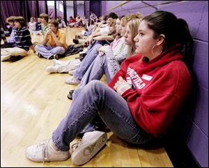 Courtney Uhl, 13, an eighth-grader at Springfield Middle School, listens to the panel yesterday.
