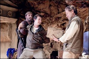 Flynn Carson (Noah Wyle), center, encounters some problems as he tries to keep a magical book out of the hands of ne er-do-wells led by his Uncle Jerry (Robert Foxworth), right.