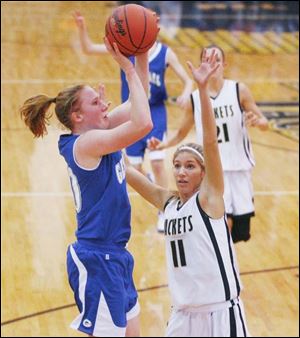 Anthony Wayne's Allison Papenfuss takes jumper over Perrysburg's Ashley Parrish last night in a key NLL matchup. Papenfus led the Generals with 20 points and 16 rebounds.
