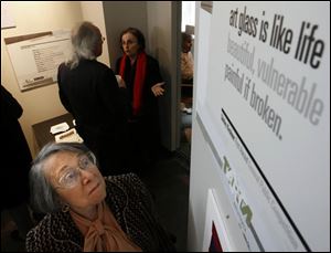 Shirley Kirshner looks over her fi rst-place poem, which is being featured on the side of a bus.