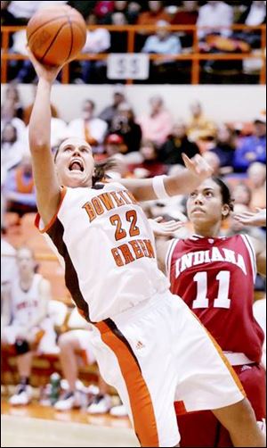 The Falcons  Ali Mann drives past the Hoosiers  Whitney
Thomas last night at Anderson Arena. Mann scored 14 points.

