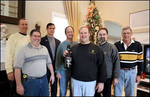 Among those watching the Army-Navy football game at the home of Bob Oehlers were, from left, Jim Kelly, Steve Heaney,
John Chapman, Don Hendershot, Mr. Oehlers, Ralph Zychowicz, and Bruce Foster. All are West Point graduates.
