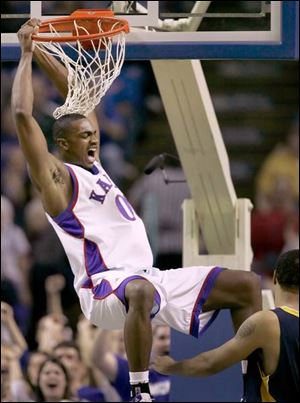 Kansas  Darrell Arthur slams home two of his nine points in the Jayhawks  victory.