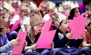 Kindergartners Catherine Owen, left, and Matt Woycitzky were among about 320 students and staff reading a passage from 'Charlotte's Web.'