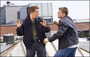In this photo provided by Warner Bros. Entertainment, actors Matt Damon and Leonardo DiCaprio are shown in a scene from 