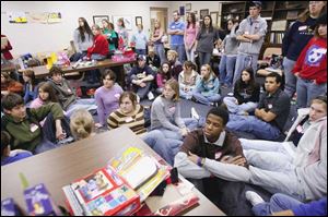Springfield High School students listen to instructions on how to wrap their 