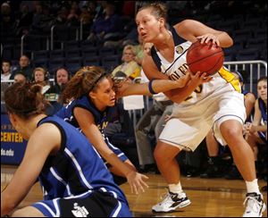 Rockets guard Danielle Bishop keeps the ball away from Indiana State s Leah Phillips.