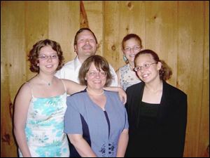 Steven DalPra in a family photo, clockwise from his right, are daughters Rachele and Giovanna, wife Colleen, and daughter Elizabeth.
