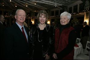 
Norm Witzler, left, Toni Stoma, and Ann Lotshaw at the Waterville Historical Society holiday celebration.