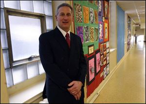 Dan Romano III, the schools' chief business manager, has been named the new treasurer.