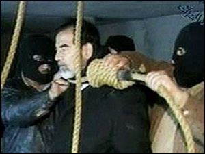This video image released by Iraqi state television shows Saddam Hussein's guards wearing ski masks and placing a noose around the deposed leader's neck moments before his execution Saturday Dec. 30, 2006.