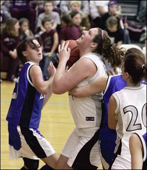 Genoa's Brittany Darling scores in the paint. Of her 38 points, 34 came within a foot of the basket against Elmwood.