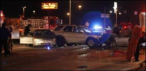 This three-car accident last night at Airport Highway and Holland-Sylvania Road was one of
several in the Toledo region yesterday. Four people were taken to area hospitals.