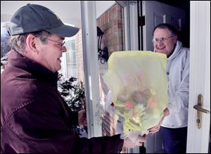 Bill Asendorf completes his mission: Delivering the flowers in Maumee to Jude Aubry, who had ordered the flowers as a Valentine's Day gift for his wife.