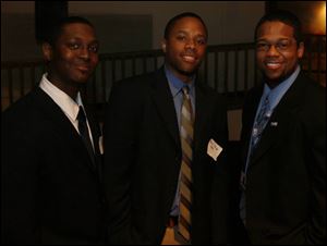 John Cole, left, Marcel Pringle, and Chris Mitchell were among the guests at the gathering for the new Toledo young professionals organization.