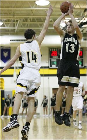 Perrysburg s David Boyce takes a shot against Northview s Chad Weaver. Boyce, a point guard, averages 7.9 points and 6.7 assists.
