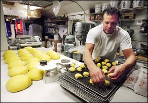 Scott Nugent, owner of Bakery Unlimited on Secor Road, adheres to the traditional Polish method when baking the Fat Tuesday treat.