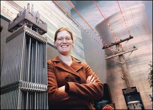 Jessica Kemp, with a model of a nuclear fuel assembly, welcomes the trend.
