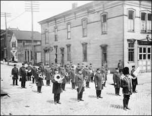 The Toledo Police Band gathers in May, 1947, outside the old East Side Police Station. One officer, Detective Lt. John McCarthy, died in the line of duty in January of that year.