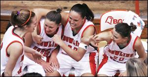 BGSU players, from left, Lindsey Goldsberry, Megan Thorburn, Ali Mann and Kate Achter celebrate at the end of the game. 