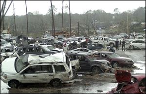 Cars were destroyed in the student parking lot at Enterprise High School in Alabama. 