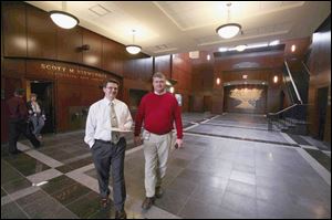 Paul Hoverman, left, president of the nonprofit performing arts foundation, which will operate the center, and Van Wert High School Principal Bill Clifton, see to last-minute details in the lobby of the $9.6 million facility.
