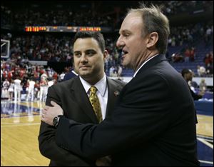Xavier coach Sean Miller, left, greets Ohio State coach Thad
Matta before the game. Miller used to be a Matta assistant.