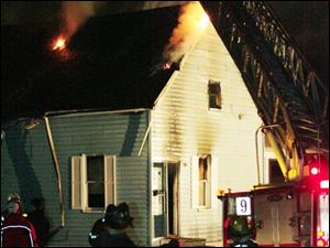 Slug:  CTY Fire19p   Date:  03/18/2007   Location:  Toledo, Ohio  Caption: THE BLADE/ERIC SUMBERG   Toledo Firefighters use Ladder Truck 9 from the South Street station to douse the home at 1545 Hamilton Street after being called to the residence around 8:15 pm.  Battalion Chief Phil Cervantes called the fire "suspicious" and said the arson investigative team had been called.    Summary:   House fire at 1545 Hamilton Street started approximately 8:15.  Residents report hearing an explosion.  Fire department believes house was vacant.