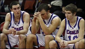 From left, Liberty-Benton s Nathan Hyde, Brandon Craft and Pat Wallace can t hide their disappointment in defeat.