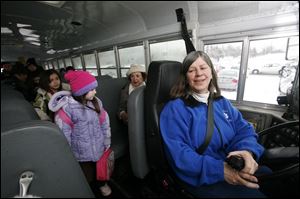 Denise Ery, who has been a bus driver for 30 years, has transported generations of Adrian students.
