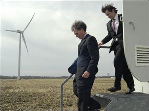 Rep. Bob Latta, left, and Terence O'Donnell, an attorney representing Renewable Resources, step out of one of the four wind turbines, March 26, during a tour at the Wood County Landfill in Bowling Green. U.S. Sen. Sherrod Brown and Gov. Ted Strickland, both Democrats, pledged during their 2006 campaigns to join forces in Washington and Columbus to make Ohio "the Silicon Valley of alternative energy." It was a lofty promise, not unlike ones Ohioans have heard before. Gov. Bob Taft launched his Third Frontier high-tech initiative in 2002, only to need two tries to secure the bond money to pay for it. Ohio later hung its high-tech hopes on landing the nearly pollution-free FutureGen power plant but lost its bid last year. 