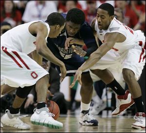 Ohio State's Mike Conley Jr., left, and David Lighty scramble for a loose ball against Georgetown's Roy Hibbert.