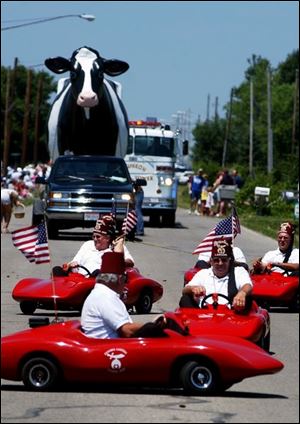 Sterlena has often loomed large during Fulton County activities. Here she is as the Zenobia Lancers of Toledo drive their cars during Delta s Chicken Festival in 2005.