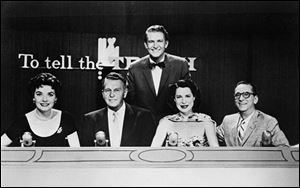 Kitty Carlisle Hart, second from right, is shown as a panelist on the television show 'To Tell The Truth,' for which she says she was best known. Master of ceremonies Bud Collyer, rear, poses with the panelists in 1957 who included Polly Bergen, left, Ralph Bellamy, Kitty Carlisle (as she was known professionally) and Hy Gardner.