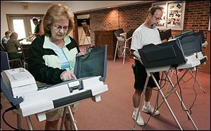 Tina Dover, left, and her husband Ron Dover, vote at the Swanton Church of the Nazarene in Swanton.