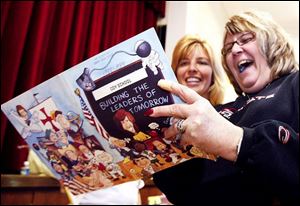 Staci Cook, left, Coy Elementary class of 1984, and Diane Spetz, whose children attend Coy, look at an old yearbook during open house at the school on Pickle Rd. in Oregon