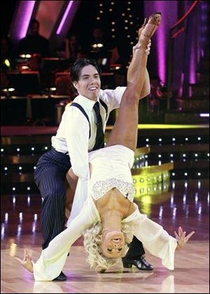 Apolo Anton Ohno and his partner Julianne Hough performing on 