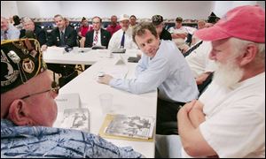 Sen. Sherrod Brown, center, holds roundtable talks with veterans at American Legion Post 587 on West Alexis Road.