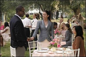 Sterling K. Brown, Kim Delaney, center, and Catherine Bell are three of the principal actors in Army Wives.