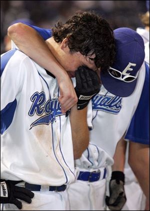 Ryan Rothenbuhler, left, and Josh Irick console each other.