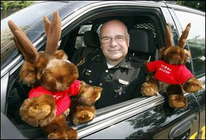 Tommy Moose may only be a stuffed toy, but he's important enough to ride in the front seat of the cruiser with Ottawa County Sheriff's Deputy Jeff Hickman on his patrols. 