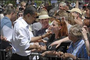 Democratic presidential hopeful Sen. Barak Obama draws a smiling crowd during a recent campaign stop in Reno, Nev.