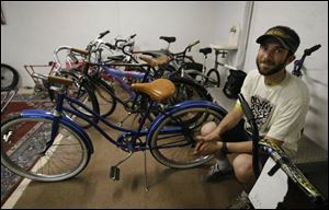 Andy Stepnick sits among bicycles belonging to the Toledo City Bicycle Co-op, which is headquartered at St. Mark s Episcopal. Mr. Stepnick is co-collaborator for the group.