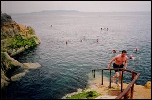People take a dip on Bloomsday at the Forty Foot bathing place in Sandycove, Ireland.