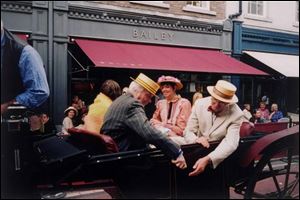 A carriage with people dressed in Edwardian garb arrives at Davy Byrnes pub on Bloomsday.